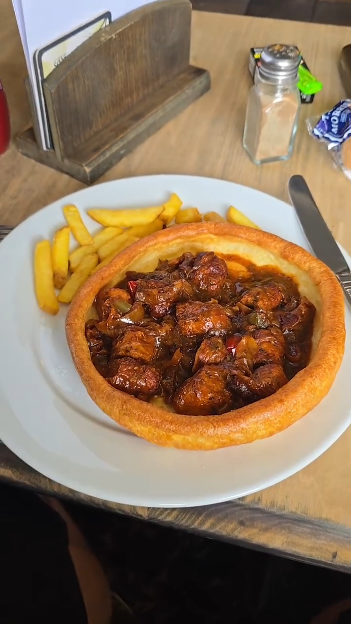 A generous Yorkshire pudding meal with chips at The Bridge